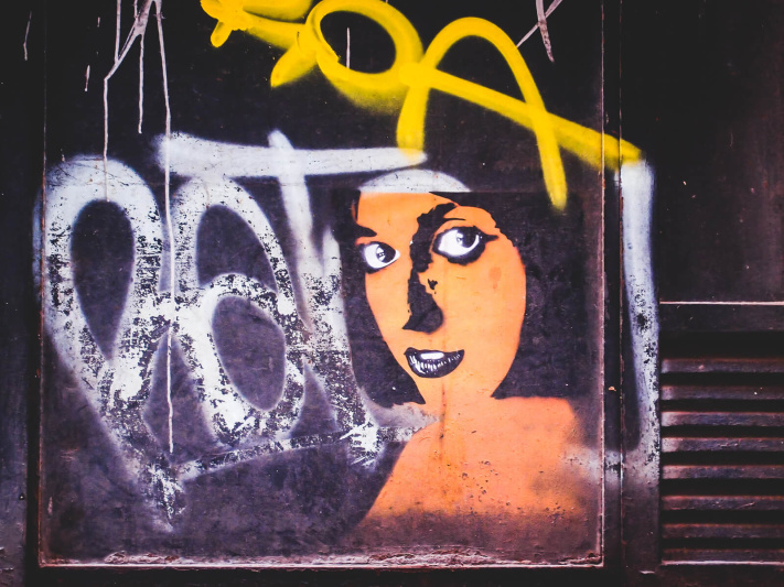 Barcelona, orange face woman, street art stencil