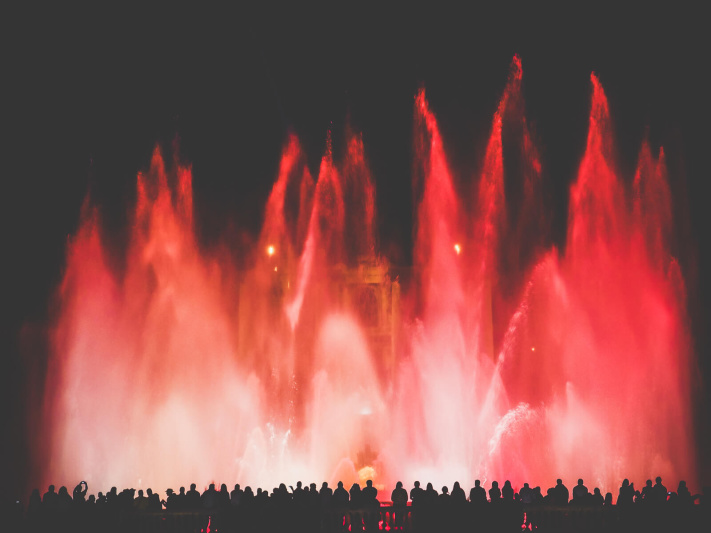 Barcelona, Montjuic fountain, people silhouette spectating, red water