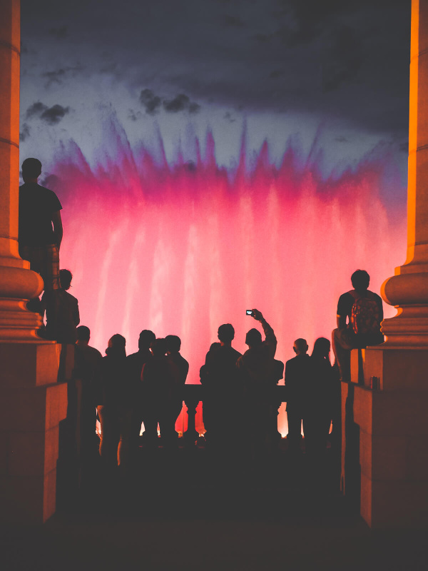 Barcelona, Montjuic fountain, red water, speople ilhouette spectating