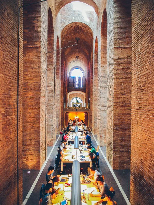 Barcelona, high brick walls, les aigues library, students working, water reservoir