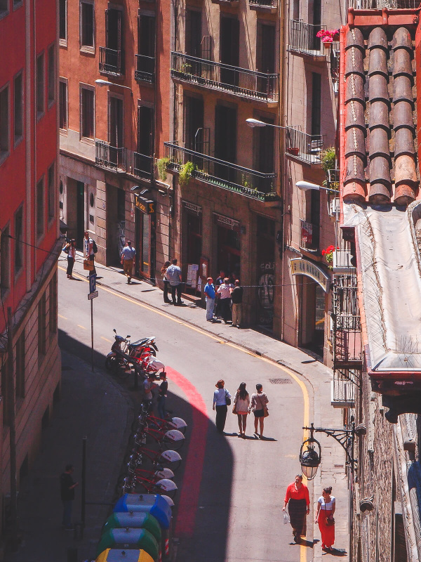 Barcelona, narrow alley streets, old town, pedestriants walking, streetlife